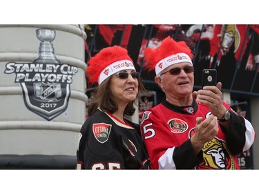 Ottawa Senators fans Valerie Hatchard and Gerry St. Germain have a great time in the Red Zone.