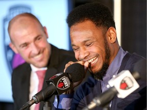 Julian de Guzman shares a light moment with Fury FC head coach Paul Dalglish, left, during the announcement of his retirement as a player on Jan. 30. Julie Oliver/Postmedia