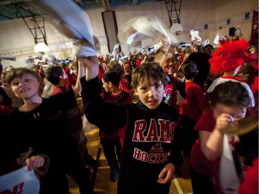 Students at A. Lorne Cassidy Elementary School wave Senators towels during a rally with former players Chris Phillips and Shaun Van Allen.