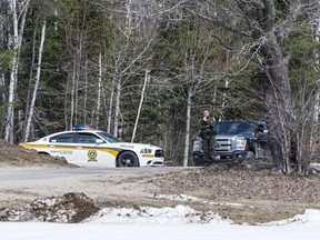 Sûreté du Québec police at the scene of a possible double homicide at 872 Chemin De Val Ombreuse near Notre Dame-du-Laus.