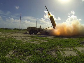 A Terminal High Altitude Area Defense (THAAD) interceptor is launched from a THAAD battery located on Wake Island, during a flight test. DoD photo.