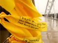 The fence rails of the Armstrong/Strandherd Road bridge in Barrhaven have blossomed with thousands of hand-tied yellow ribbons in remembrance of the sacrifice our men and women in uniform made at Vimy Ridge. (Photo: Julie Oliver/Postmedia)