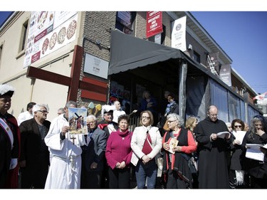 The Fifth Station of the Cross at Pasticceria Gelateria. Parishioners from St. Anthony's church performed the Way of the Cross during Good Friday in Little Italy on April 14, 2017.