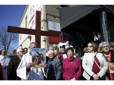 The Fifth Station of the Cross at Pasticceria Gelateria. Parishioners from St. Anthony's church performed the Way of the Cross during Good Friday in Little Italy on April 14, 2017.