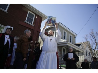 The Fourth Station of the Cross at Famiglia Pietrantonio. Parishioners from St. Anthony's church performed the Way of the Cross during Good Friday in Little Italy on April 14, 2017.