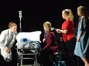 Isabella McKay, preforms as doctor, Olivia Barber preforms as the mother, Kaitlyn Keylor as the nurse, and Tessa Dougan, preforms as Susan Connors during St. Francis Xavier's Cappies production of the Girl in the Mirror, on Apr. 22, 2017 in Ottawa.