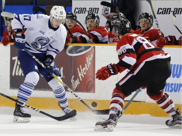 The Mississauga Steelheads Trent Fox, left, tries to get the puck past the Ottawa 67s Chris Martenet during second period action of their OHL playoff hockey game at TD Place in Ottawa on Sunday, April 2, 2017.   (Patrick Doyle)  ORG XMIT: 0402 67s 04