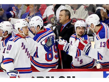 The New Rangers bench celebrates J.T. Miller's goal in the first period.