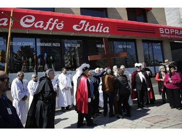 The Ninth Station of the Cross at Trattoria Caffe Italia. Parishioners from St. Anthony's church performed the Way of the Cross during Good Friday in Little Italy on April 14, 2017.