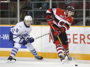 The Ottawa 67s Kevin Bahl, right, is chased by the Mississauga Steelheads Ryan McLeod during second period action of their OHL playoff hockey game at TD Place in Ottawa on Sunday, April 2, 2017.   (Patrick Doyle)  ORG XMIT: 0402 67s 05