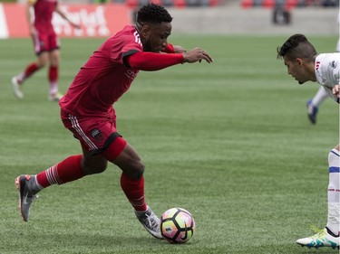 Eddie Edward tries to get the ball past a Toronto FC II defender.