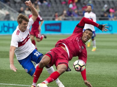 Ottawa's Steevan Dos Santos collides with Toronto's Brandon Aubrey.