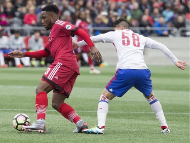 Toronto's Anthony Osorio tries to stop Otttawa's Eddie Edward.