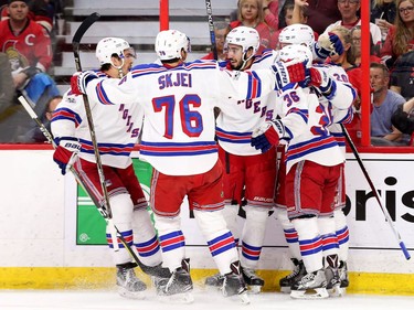 The Rangers celebrate the third goal in the second period.