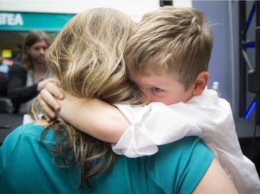Natalie Laforge holds her son, seven-year-old Corben Laforge, who may have become just a tiny bit shy after meeting July Talk.