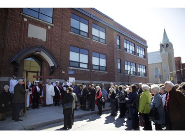 The Second Station of the Cross at St. Anthony School. Parishioners from St. Anthony's church performed the Way of the Cross during Good Friday in Little Italy on April 14, 2017.