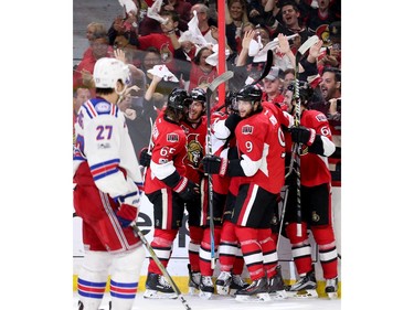 The Senators celebrate their tying goal in the third period.