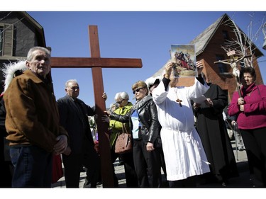 The Seventh Station of the Cross at Caffe Amici. Parishioners from St. Anthony's church performed the Way of the Cross during Good Friday in Little Italy on April 14, 2017.