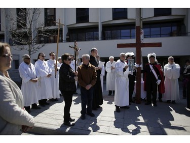 The Twelfth Station of the Cross at the Adult High School. Parishioners from St. Anthony's church performed the Way of the Cross during Good Friday in Little Italy on April 14, 2017.