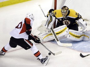 The Ottawa Senators' Tom Pyatt cuts in on Boston Bruins goalie Tuukka Rask.