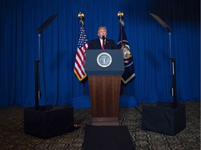 TOPSHOT - US President Donald Trump delivers a statement on Syria from the Mar-a-Lago estate in West Palm Beach, Florida, on April 6, 2017. Trump ordered a massive military strike against a Syria Thursday in retaliation for a chemical weapons attack they blame on President Bashar al-Assad. A US official said 59 precision guided missiles hit Shayrat Airfield in Syria, where Washington believes Tuesday's deadly attack was launched.  /
