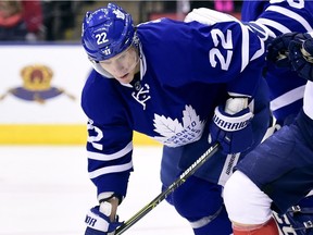 Toronto Maple Leafs defenceman Nikita Zaitsev (22) tries to block Florida Panthers right wing Reilly Smith (18) as Toronto Maple Leafs goalie Curtis McElhinney (35) watches the play during first period NHL hockey action, in Toronto on Tuesday, March 28, 2017.