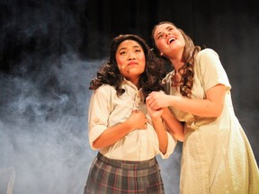 Tracy Turnblad played by Jessica Agpoon (L) and Penny played by Kayla Lalonde (R), during St. Patrick's High School's Cappies production of Hairspray, on April 7, 2017, in Ottawa, ON. (Lina Akkawi/Ottawa Citizen/Student)