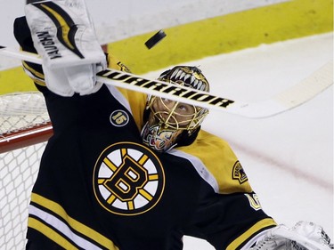 Boston Bruins goalie Tuukka Rask makes a stick save during the first period of the team's NHL hockey game Ottawa Senators, Thursday, April 6, 2017, in Boston.