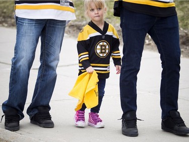 Two-year-old Avery Hall walks up to the Canadian Tire Centre before the Ottawa Senators faced off to the Boston Bruins.