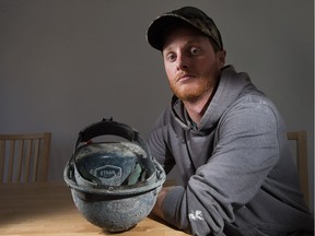 Ethan Allard died during a construction incident in January 2017. His brother, Tyson, pictured above, poses with a hard hat with Ethan's name etched on it.