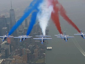 The Patrouille de France alphajets roar over One World Trade Center in New York during their 2017 North American tour.