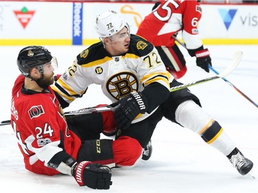 Viktor Stalberg of the Ottawa Senators battles against Frank Vatrano.