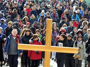 Way of the Cross, led by Terrence Prendergast S.J., Archbishop of Ottawa, wound it's way through the streets of downtown Ottawa on Friday March 29,2013.