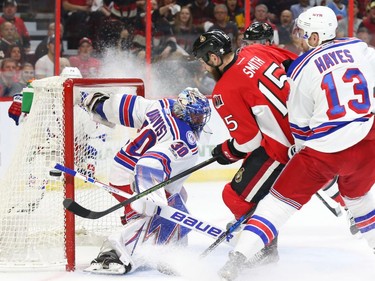 The Ottawa Senators' Zack Smith just misses against Henrik Lundqvist of the New York Rangers during the first period at the Canadian Tire Centre on April 27, 2017.