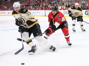 The Senators' Zack Smith tries to control the Bruins' Zdeno Chara in the first period of Game 1 at the Canadian Tire Centre on Wednesday, April 12, 2017.