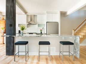 The homeowners wanted to embrace a modern design style that would suit their tastes and needs. They took down the kitchen wall and replaced it with a large island- and then incorporated lots of wood, stone and tile.