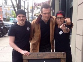 Serge Patoka (left) and Kyle “Doug” Gus (right) pose with actor Liam Neeson after he stopped into Big Star Sandwich Co. in New Westminster, B.C., on Tuesday, May 2, 2017. THE CANADIAN PRESS/HO-Courtesy of Big Star Sandwich Co. MANDATORY CREDIT