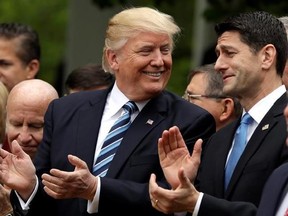 In this May 4, 2017, photo, President Donald Trump talks to House Speaker Paul Ryan of Wis. in the Rose Garden of the White House in Washington, after the House pushed through a health care bill. (AP Photo/Evan Vucci)