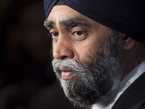 Minister of National Defence Minister Harjit Sajjan speaks with the media after delivering a speech to the Conference of Defence Associations Institute in Ottawa, Wednesday May 3, 2017. Sajjan has been under fire following his exaggeration of his role in Afghanistan. THE CANADIAN PRESS/Adrian Wyld
