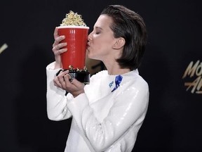 CORRECTS PHOTOGRAPHER FROM CHRIS PIZZELLO TO RICHARD SHOTWELL -Millie Bobby Brown winner of the award for best actor in a show for &ampquot;Stranger Things&ampquot; kisses her award at the MTV Movie and TV Awards at the Shrine Auditorium on Sunday, May 7, 2017, in Los Angeles. (Photo by Richard Shotwell/Invision/AP)