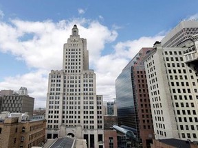 FILE - In this March 27, 2013, file photo the Bank of America Building, center, also known as the Superman building, stands among other buildings in downtown Providence, R.I. A $54 million lawsuit over Rhode Island‚Äôs tallest building has been settled just before a trial was scheduled to begin in federal court. A trial had been set to begin Monday, May 8, 2017. (AP Photo/Steven Senne, File)