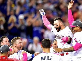 Toronto Blue Jays outfielder Kevin Pillar (second right) celebrates his game winning home run against the Seattle Mariners with teammates during ninth inning American League baseball action in Toronto, Sunday, May 14, 2017.