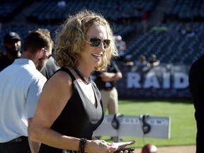 FILE - In this Aug. 14, 2015, file photo, announcer Beth Mowins walks on the field before an NFL preseason football game between the Oakland Raiders and the St. Louis Rams in Oakland, Calif. ESPN announced May 16, 2017, that Mowins will call the second part of a season-opening ‚ÄúMonday Night Football‚Äù doubleheader in September, making her the first woman do play-by-play duties on an NFL game in 30 years. (AP Photo/Ben Margot, File)