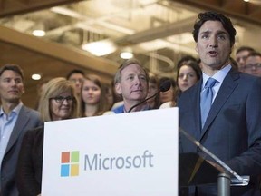 Prime Minister Justin Trudeau addresses a gathering during the opening of Microsoft&#039;s new location in Vancouver on June 17, 2016. Prime Minister Justin Trudeau was to pitch major multinational companies on investing in Canada&#039;s technology sector on Wednesday, joining top business leaders inside the closed-door Microsoft CEO Summit in Redmond, Wash. THE CANADIAN PRESS/Jonathan Hayward