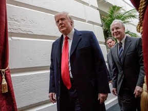 FILE - In this March 21, 2017 file photo, President Donald Trump, followed by Health and Human Services Secretary Tom Price, leaves Capitol Hill Washington. It‚Äôs looking like another year of big premium increases and dwindling choice for many consumers who buy their own health insurance, but why, and who‚Äôs to blame? President Donald Trump has seized on early market rumbles as validation of his claim that ‚ÄúObamacare‚Äù is collapsing. (AP Photo/J. Scott Applewhite, File)