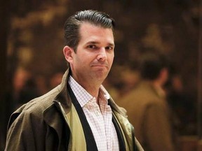 FILE -- In this Nov. 16, 2016 file photo, Donald Trump Jr., son of then President-elect Donald Trump, walks from the elevator at Trump Tower, in New York. Trump Jr. traveled recently to Dubai to discuss ‚Äúnew ideas‚Äù with a billionaire business partner and give a commencement address at a private university. An Instagram picture posted Tuesday, May 16, 2017 showed Trump with Hussain Sajwani, the chairman of DAMAC Properties, who built one Trump golf course and plans a second in Dubai. (AP Phot