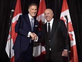 Conservative Party leadership candidate Maxime Bernier, left, shakes hands with Kevin O&#039;Leary at a news conference in Toronto on April 26, 2017. Celebrity businessman Kevin O&#039;Leary dropped out of the Conservative leadership race and pledged to back Quebec MP Maxime Bernier&#039;s campaign all the way to decision day, but the duo are also working on a plan for afterwards. THE CANADIAN PRESS/Nathan Denette