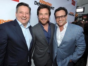 FILE - In this April 29, 2013, file photo, Ted Sarandos, Jason Bateman, and Mitchell Hurwitz attend the season four premiere of &ampquot;Arrested Development&ampquot; at the TCL Chinese Theatre in Los Angeles. Netflix announced on May 17, 2017, that the series would return for a fifth season in 2018. (Photo by John Shearer/Invision/AP, File)