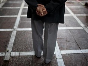 In this Thursday, May 18, 2017 photo an elderly man walks during a rainfall in central Athens. Greek retirees say they are struggling to survive on ever dwindling pensions with repeated cuts imposed by successive governments as part of their country&#039;s three international bailouts. (AP Photo/Petros Giannakouris)