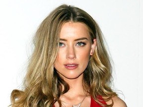 FILE - In this April 12, 2016, file photo, Amber Heard attends the LA Premiere of &ampquot;The Adderall Diaries&ampquot; in Los Angeles. Heard and &ampquot;Aquaman&ampquot; director James Wan shared pictures of Heard in character as Aquaman&#039;s love interest Mera on Thursday, May 18, 2017. &ampquot;Aquaman&ampquot; is currently filming in Australia. (Photo by John Salangsang/Invision/AP, File)
